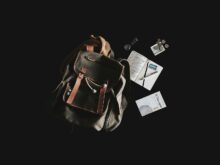 black and brown backpack with black nackground