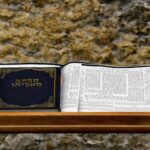 white book page on brown marble table