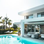 white concrete building with swimming pool